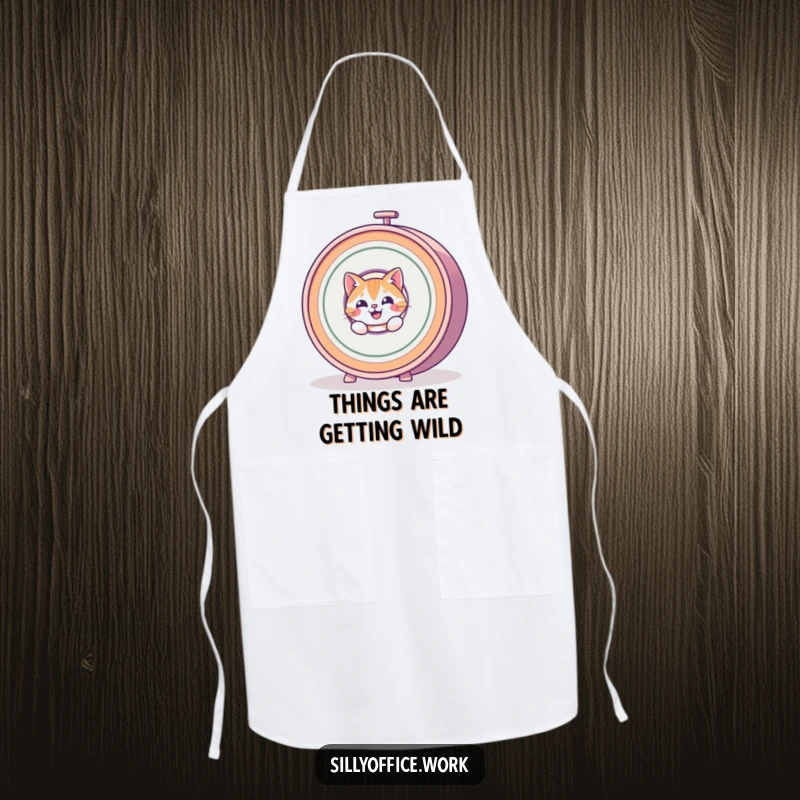 Funny Cat Apron: A mischievous cat peeks from behind a spinning rolodex, bringing humor to kitchen tasks.