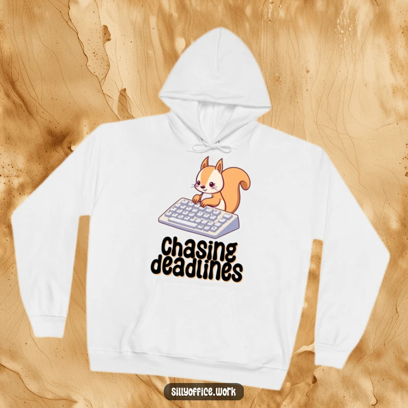 Funny kawaii squirrel typing on a giant keyboard, featured on a warm hoodie, blending comfort and focus.