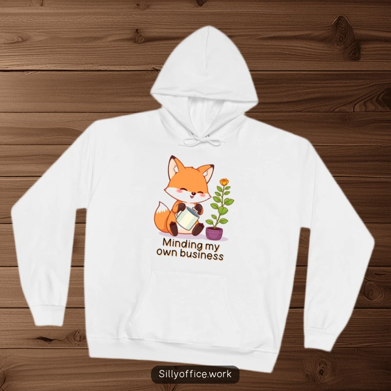 Funny kawaii fox hoodie, enthusiastically watering a tiny office plant, perfect for cozying up with a smile.
