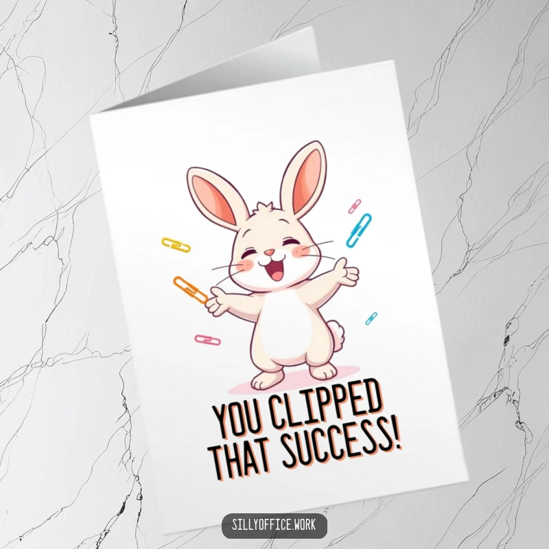 Funny Free Printable cheerful bunny juggling paper clips with excitement, congratulating them, a festive downloadable card.