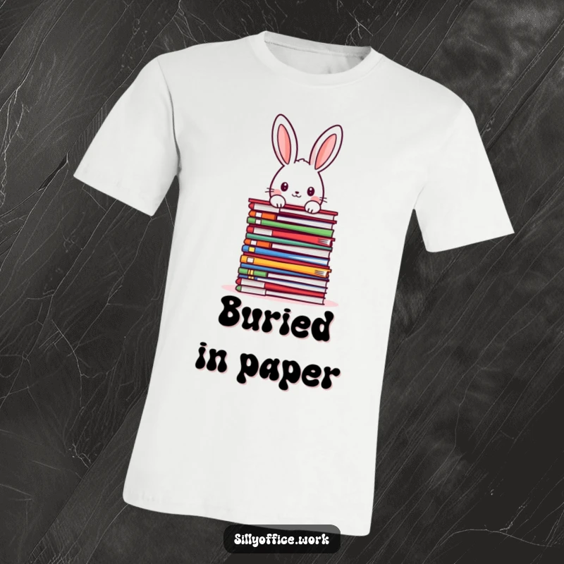 Funny kawaii rabbit peeking over a huge stack of colorful files, on a soft t-shirt, a humorous and relatable design.