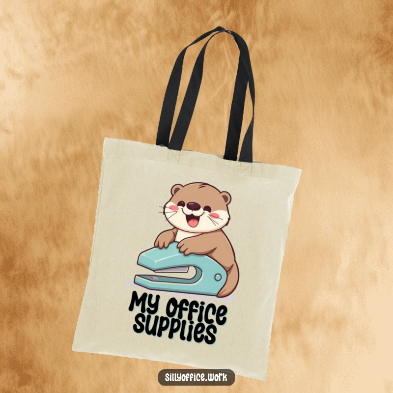 Funny tote bag: A playful otter gleefully slides down a stapler, capturing a moment of hilarious office adventure.